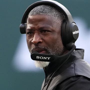 Oct 12, 2025; Tottenham, United Kingdom; New York Jets head coach Aaron Glenn watches from the sidelines in the second half during an NFL International Series game against the Denver Broncos at Tottenham Hotspur Stadium. Mandatory Credit: Kirby Lee-Imagn Images