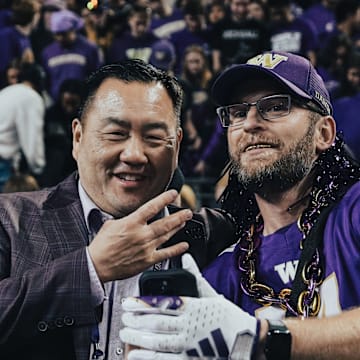 Pat Chun obliges a fan with a postgame selfie. 