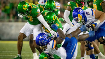 A pack of Oregon defenders overwhelm Boise State running back Ashton Jeanty as the Oregon Ducks host the Boise State Broncos Saturday, Sept. 7, 2024 at Autzen Stadium in Eugene, Ore.