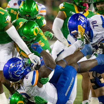 A pack of Oregon defenders overwhelm Boise State running back Ashton Jeanty as the Oregon Ducks host the Boise State Broncos Saturday, Sept. 7, 2024 at Autzen Stadium in Eugene, Ore.