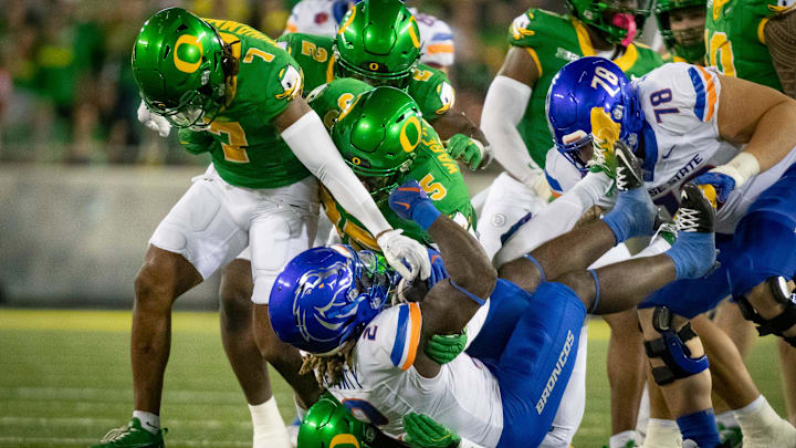 A pack of Oregon defenders overwhelm Boise State running back Ashton Jeanty as the Oregon Ducks host the Boise State Broncos Saturday, Sept. 7, 2024 at Autzen Stadium in Eugene, Ore.