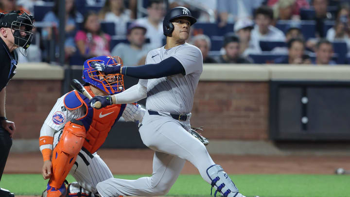 Jun 25, 2024; New York City, New York, USA; New York Yankees right fielder Juan Soto (22) follows through on a solo home run against the New York Mets during the fifth inning at Citi Field. Mandatory Credit: Brad Penner-USA TODAY Sports