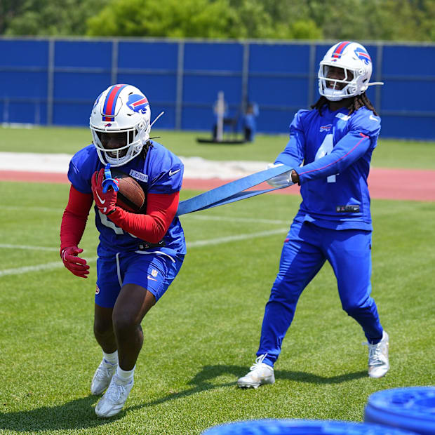 running back Frank Gore Jr. (20) works out with running back James Cook (4)