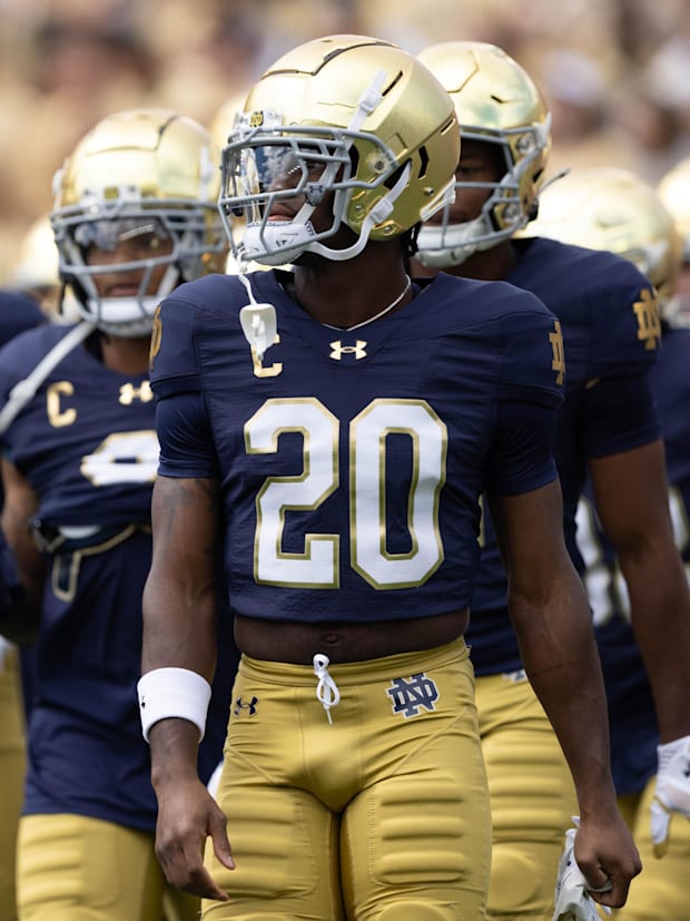 Notre Dame corner back Benjamin Morrison walks with his team during warm ups before a NCAA college football game. 