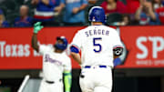 Aug 26, 2025; Arlington, Texas, USA; Texas Rangers shortstop Corey Seager (5) rounds the bases after hitting a home run during the seventh inning against the Los Angeles Angels at Globe Life Field. 