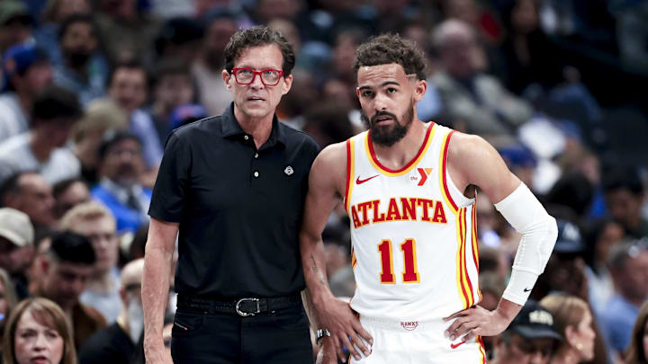 Apr 2, 2025; Dallas, Texas, USA;  Atlanta Hawks head coach Quin Snyder speaks with Atlanta Hawks guard Trae Young (11) during the first half against the Dallas Mavericks at American Airlines Center. Mandatory Credit: Kevin Jairaj-Imagn Images