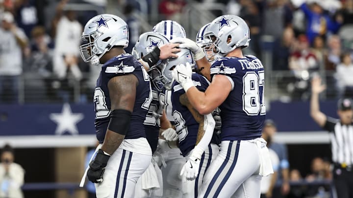 Dallas Cowboys running back Rico Dowdle celebrates with teammates after scoring a touchdown