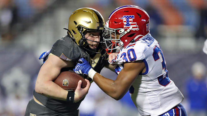 Louisiana Tech's Alonzo Jackson Jr. tries to tackle Army's Bryson Daily during the 2024 Independence Bowl. Louisiana Tech's Alonzo Jackson Jr. tries to tackle Army's Bryson Daily during the 2024 Independence Bowl.