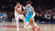 Dec 3, 2025; New York, New York, USA;  Charlotte Hornets guard LaMelo Ball (1) drives against New York Knicks guard Miles McBride (2) in the second quarter at Madison Square Garden. Mandatory Credit: Wendell Cruz-Imagn Images