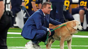 Jan 8, 2024; Houston, TX, USA; ESPN analyst Kirk Herbstreit walks his dog Ben before the 2024 College Football Playoff national championship game between the Michigan Wolverines and the Washington Huskies at NRG Stadium