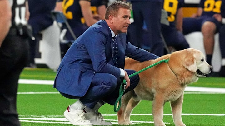 Jan 8, 2024; Houston, TX, USA; ESPN analyst Kirk Herbstreit walks his dog Ben before the 2024 College Football Playoff national championship game between the Michigan Wolverines and the Washington Huskies at NRG Stadium. Mandatory Credit: Kirby Lee-Imagn Images