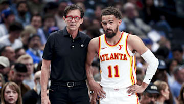 Atlanta Hawks head coach Quin Snyder and Trae Young #11 look on against the Dallas Mavericks.