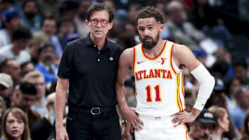 Apr 2, 2025; Dallas, Texas, USA;  Atlanta Hawks head coach Quin Snyder speaks with Atlanta Hawks guard Trae Young (11) during the first half against the Dallas Mavericks at American Airlines Center. Mandatory Credit: Kevin Jairaj-Imagn Images