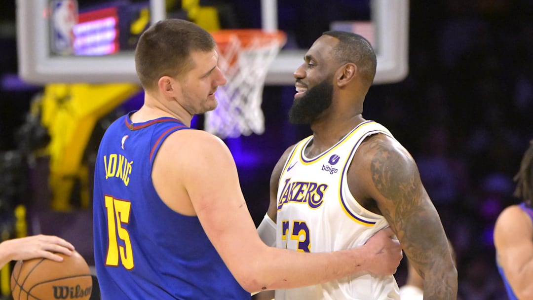 Mar 2, 2024; Los Angeles, California, USA;  Los Angeles Lakers forward LeBron James (23) is greeted by Denver Nuggets center Nikola Jokic (15) at the start of the game at Crypto.com Arena.