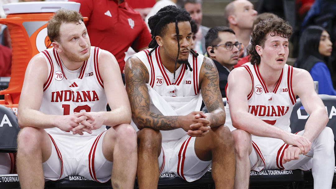 Mar 11, 2026; Chicago, IL, USA; Indiana Hoosiers forward Tucker Devries (12), guard Lamar Wilkerson (3) and guard Conor Enright (5) sit on the bench during the second half at United Center. 