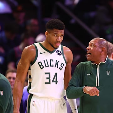 Feb 6, 2024; Phoenix, Arizona, USA; Milwaukee Bucks head coach Doc Rivers talks to forward Giannis Antetokounmpo (34) against the Phoenix Suns at Footprint Center. Mandatory Credit: Mark J. Rebilas-Imagn Images