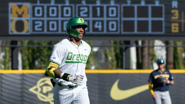  Jacob Walsh bombed a pair of home runs for the Ducks and Mason Neville led off the first with another, but Oregon pitching plunked seven batters and gave up 14 runs to the No. 10 Bruins.