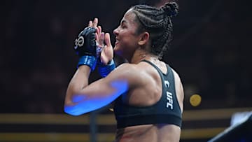 Aug 19, 2023; Boston, MA, USA; Natalia Silva (blue gloves)  reacts to defeating Andrea Lee (red gloves) during UFC 292 at TD Garden. Mandatory Credit: Bob DeChiara-Imagn Images