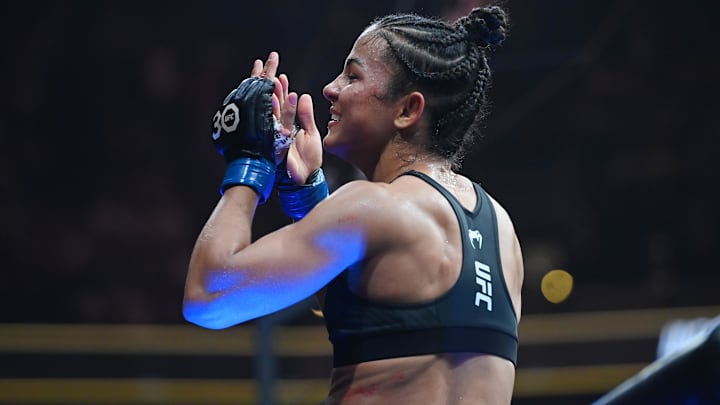 Aug 19, 2023; Boston, MA, USA; Natalia Silva (blue gloves)  reacts to defeating Andrea Lee (red gloves) during UFC 292 at TD Garden. Mandatory Credit: Bob DeChiara-Imagn Images