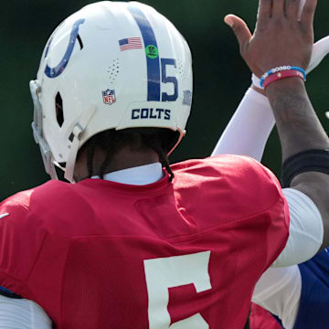 Indianapolis Colts quarterback Anthony Richardson (5) high fives wide receiver Josh Downs (1) during training camp Tuesday, July 30, 2024, at Grand Park Sports Complex in Westfield.