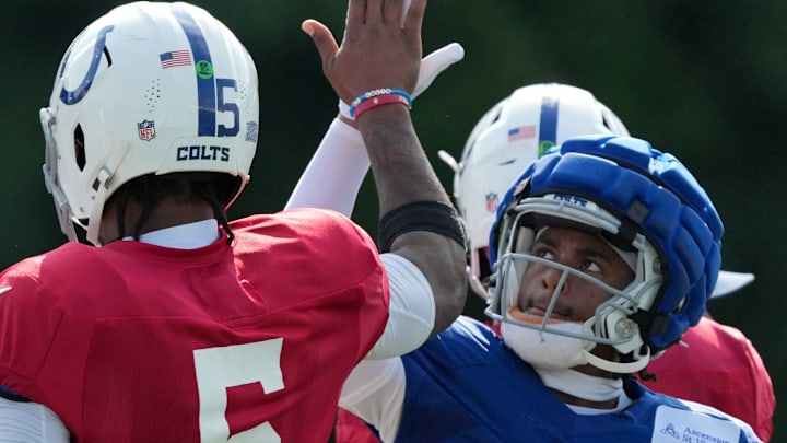 Indianapolis Colts quarterback Anthony Richardson (5) high fives wide receiver Josh Downs (1) during training camp Tuesday, July 30, 2024, at Grand Park Sports Complex in Westfield.