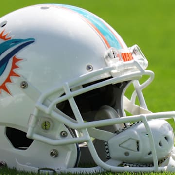Aug 17, 2022; Miami Gardens, Florida, US; A general view of a Miami Dolphins helmet on the field during practice at Baptist Health Training Complex. Mandatory Credit: Jasen Vinlove-Imagn Images