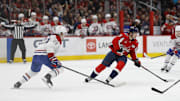 Jan 10, 2025; Washington, District of Columbia, USA; Washington Capitals center Dylan Strome (17) skates with the puck as Montreal Canadiens defenseman Kaiden Guhle (21) defends in the third period at Capital One Arena. Mandatory Credit: Geoff Burke-Imagn Images