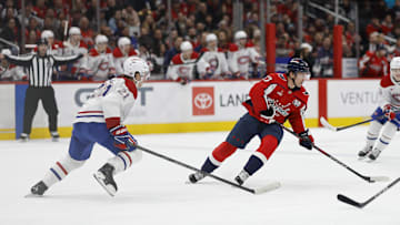 Jan 10, 2025; Washington, District of Columbia, USA; Washington Capitals center Dylan Strome (17) skates with the puck as Montreal Canadiens defenseman Kaiden Guhle (21) defends in the third period at Capital One Arena. Mandatory Credit: Geoff Burke-Imagn Images
