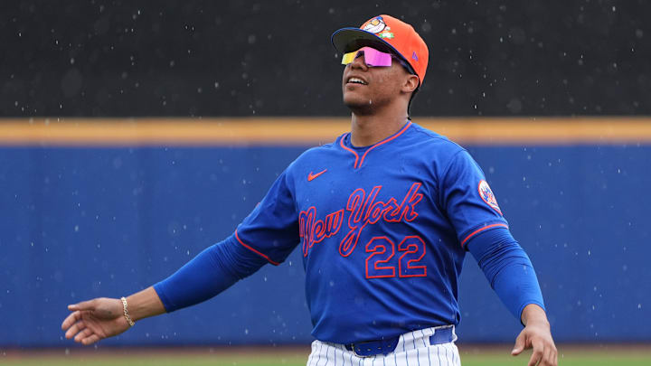 Feb 28, 2026; Port St. Lucie, Florida, USA;  New York Mets right fielder Juan Soto (22) stretches in a light rain before the game against the Washington Nationals at Clover Park. Mandatory Credit: Jim Rassol-Imagn Images