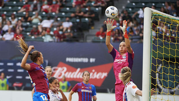 Olympique Lyonnais goalkeeper Christiane Endler stops a corner kick.