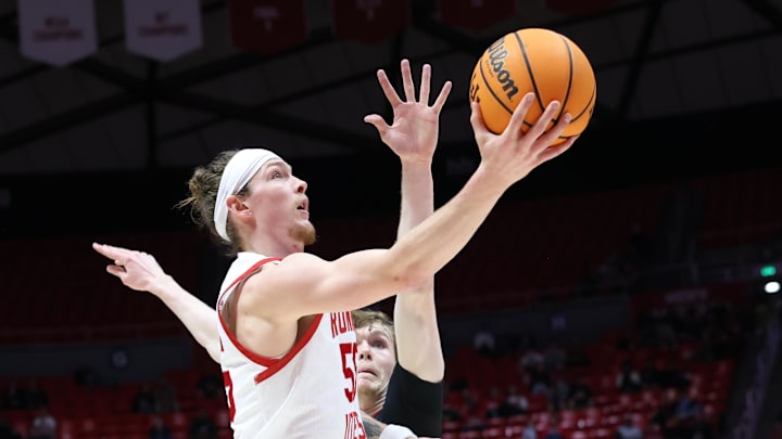 Feb 29, 2024; Salt Lake City, Utah, USA; Utah Utes guard Gabe Madsen (55) lays the ball up against the Stanford Cardinal during the second half at Jon M. Huntsman Center. Mandatory Credit: Rob Gray-Imagn Images