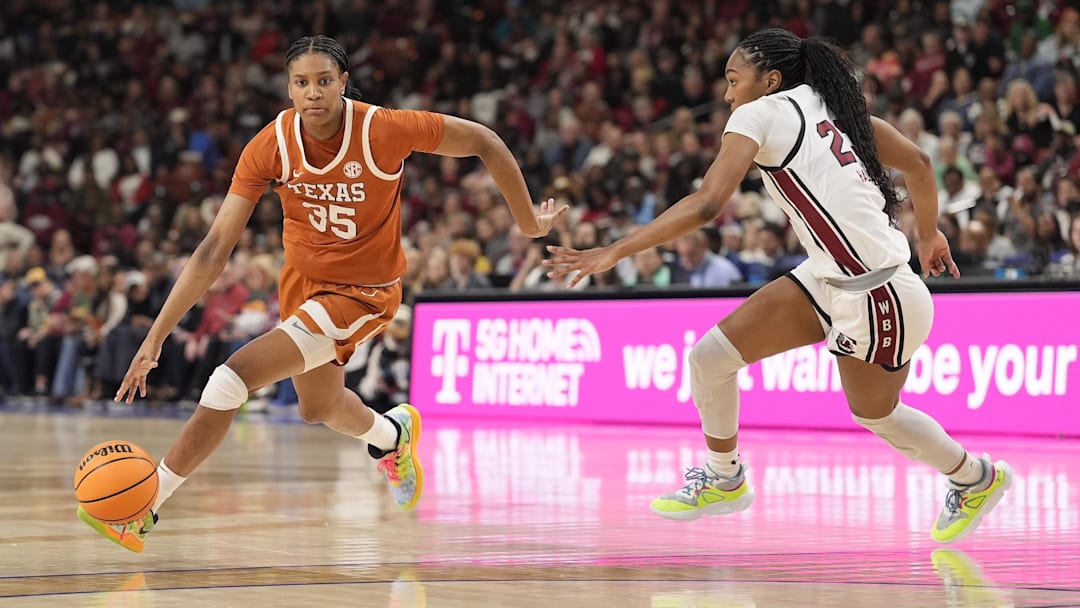 March 9, 2025; Greenville, SC, USA; Texas Longhorns forward Madison Booker (35) goes to the basket defended but South Carolina Gamecocks guard Bree Hall (23) during the first half at Bon Secours Wellness Arena. Mandatory Credit: Jim Dedmon-Imagn Images