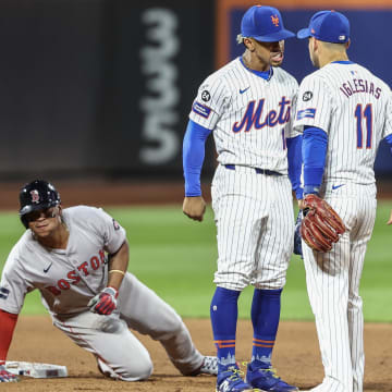 Sep 3, 2024; New York City, New York, USA;  New York Mets shortstop Francisco Lindor (12) and second baseman Jose Iglesias (11) after completing an inning ending double play in the eighth inning against the Boston Red Sox at Citi Field. Mandatory Credit: Wendell Cruz-Imagn Images