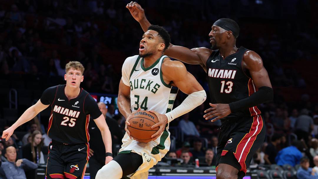 Mar 12, 2026; Miami, Florida, USA; Milwaukee Bucks forward Giannis Antetokounmpo (34) drives to the basket against Miami Heat center Bam Adebayo (13) during the first quarter at Kaseya Center. Mandatory Credit: Sam Navarro-Imagn Images