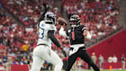 Arizona Cardinals quarterback Kyler Murray (1) throws the ball over Tennessee Titans linebacker Jihad Ward (53)at State Farm Stadium in Glendale on Oct. 5, 2025.