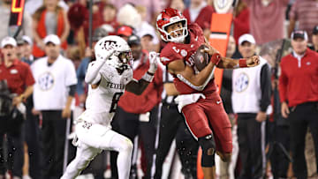 Oct 18, 2025; Fayetteville, Arkansas, USA; Arkansas Razorbacks quarterback Taylen Green (10) rushes during the fourth quarter as Texas A&M Aggies cornerback Jordan Shaw (8) defends at Donald W. Reynolds Razorback Stadium. Mandatory Credit: Nelson Chenault-Imagn Images