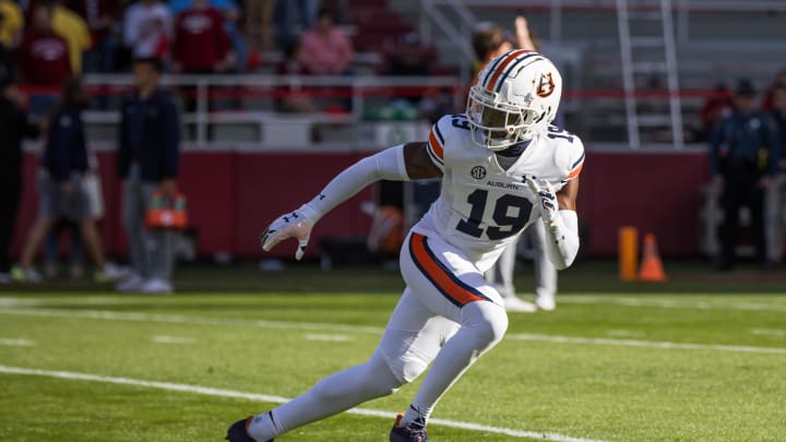 Nov 11, 2023; Fayetteville, Arkansas, USA;  Auburn Tigers safety Sylvester Smith (19) warms up before the game against the Arkansas Razorbacks at Donald W. Reynolds Razorback Stadium. Mandatory Credit: Brett Rojo-USA TODAY Sports