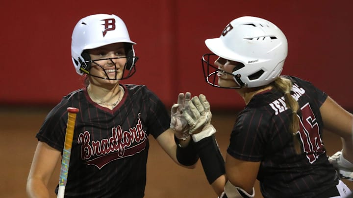 Kenosha Bradford High School's Robin Loewen (15) celebrates scoring a run with Lauren Jeanblanc (16) during the WIAA Division 1 championship softball game Saturday, June 08, 2024.