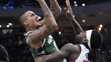 Dec 3, 2025; Milwaukee, Wisconsin, USA; Milwaukee Bucks forward Kyle Kuzma (18) drives to the basket against Detroit Pistons forward Isaiah Stewart (28) in the first half at Fiserv Forum. Mandatory Credit: Michael McLoone-Imagn Images