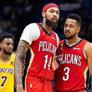 Mar 14, 2023; New Orleans, Louisiana, USA; New Orleans Pelicans guard CJ McCollum (3) talks to forward Brandon Ingram (14) against the Los Angeles Lakers during the second half at Smoothie King Center.