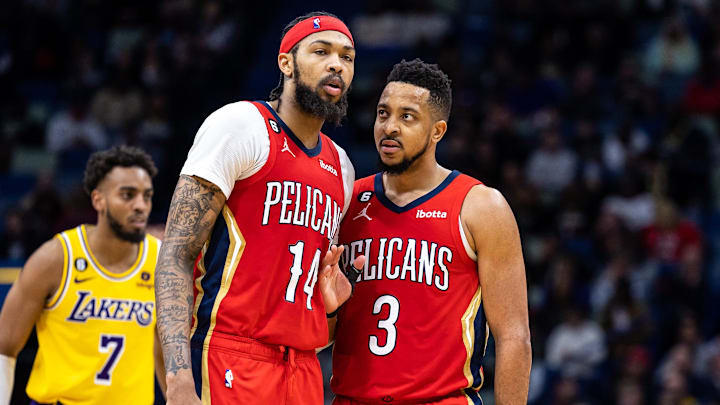 Mar 14, 2023; New Orleans, Louisiana, USA; New Orleans Pelicans guard CJ McCollum (3) talks to forward Brandon Ingram (14) against the Los Angeles Lakers during the second half at Smoothie King Center.