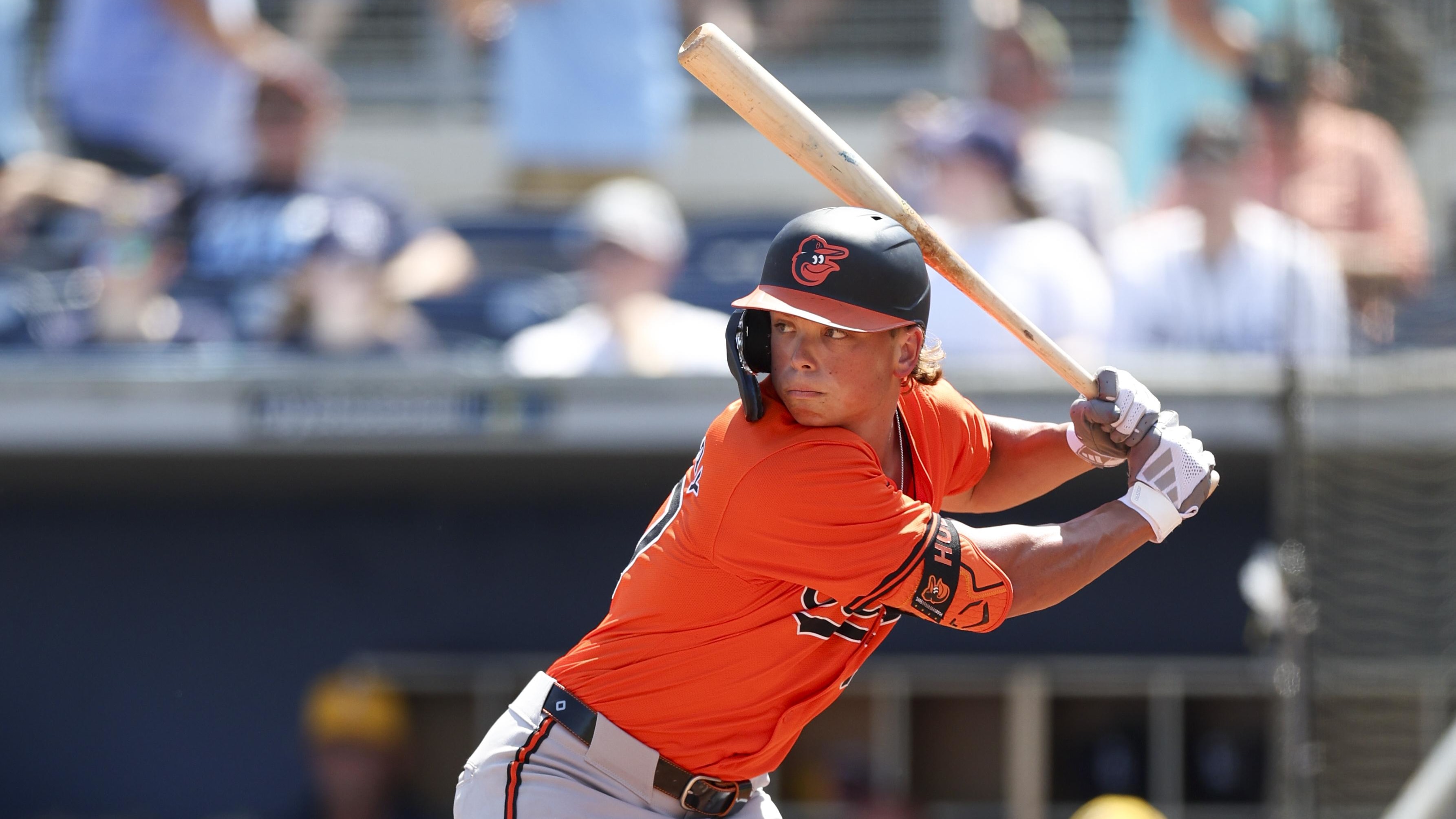 Jackson Holliday swings at a pitch