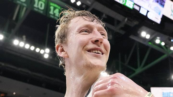 Milwaukee Bucks guard AJ Green (20) reacts after being doused with water following the game against the Brooklyn Nets at Fiserv Forum on Apr 10, 2026.
