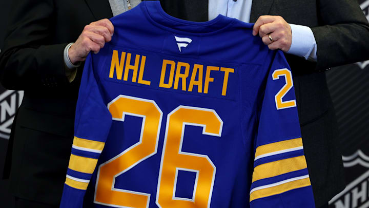 Jan 12, 2026; Buffalo, New York, USA;  NHL Commissioner Gary Bettman and Buffalo Sabres owner Terry Pegula pose for a photo during a press conference announcing the 2026 NHL Draft taking place in Buffalo at KeyBank Center. Mandatory Credit: Timothy T. Ludwig-Imagn Images