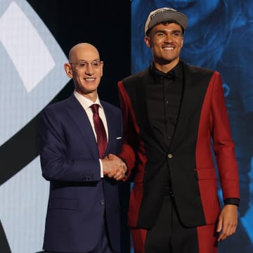 Jun 26, 2024; Brooklyn, NY, USA; Tristan da Silva poses for photos with NBA commissioner Adam Silver after being selected in the first round by the Orlando Magic in the 2024 NBA Draft at Barclays Center. 
