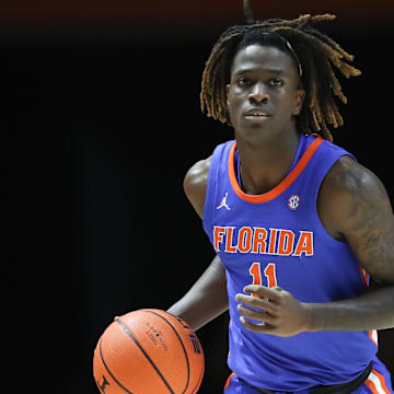 Feb 1, 2025; Knoxville, Tennessee, USA; Florida Gators guard Denzel Aberdeen (11) brings the ball up court against the Tennessee Volunteers during the second half at Thompson-Boling Arena at Food City Center. Mandatory Credit: Randy Sartin-Imagn Images