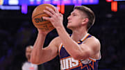 Apr 6, 2025; New York, New York, USA; Phoenix Suns guard Grayson Allen (8) shoots the ball during the first half against the New York Knicks at Madison Square Garden. Mandatory Credit: Vincent Carchietta-Imagn Images