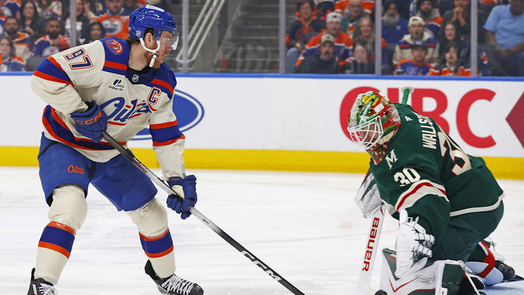 Jan 31, 2026; Edmonton, Alberta, CAN; Minnesota Wild goaltender Jesper Wallstedt (30) makes a save on Edmonton Oilers forward Connor McDavid (97) during the first period at Rogers Place. Mandatory Credit: Perry Nelson-Imagn Images