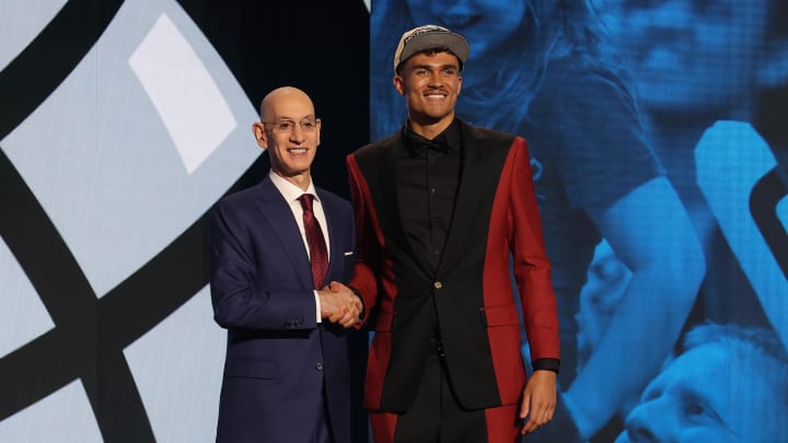 Jun 26, 2024; Tristan da Silva poses for photos with NBA commissioner Adam Silver after being selected in the first round by the Orlando Magic in the 2024 NBA Draft at Barclays Center. 