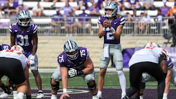 Sep 28, 2024; Manhattan, Kansas, USA; Kansas State Wildcats quarterback Avery Johnson (2) waits for the snap from center Sam Hecht (75) against the Oklahoma State Cowboys during the fourth quarter at Bill Snyder Family Football Stadium. Mandatory Credit: Scott Sewell-Imagn Images